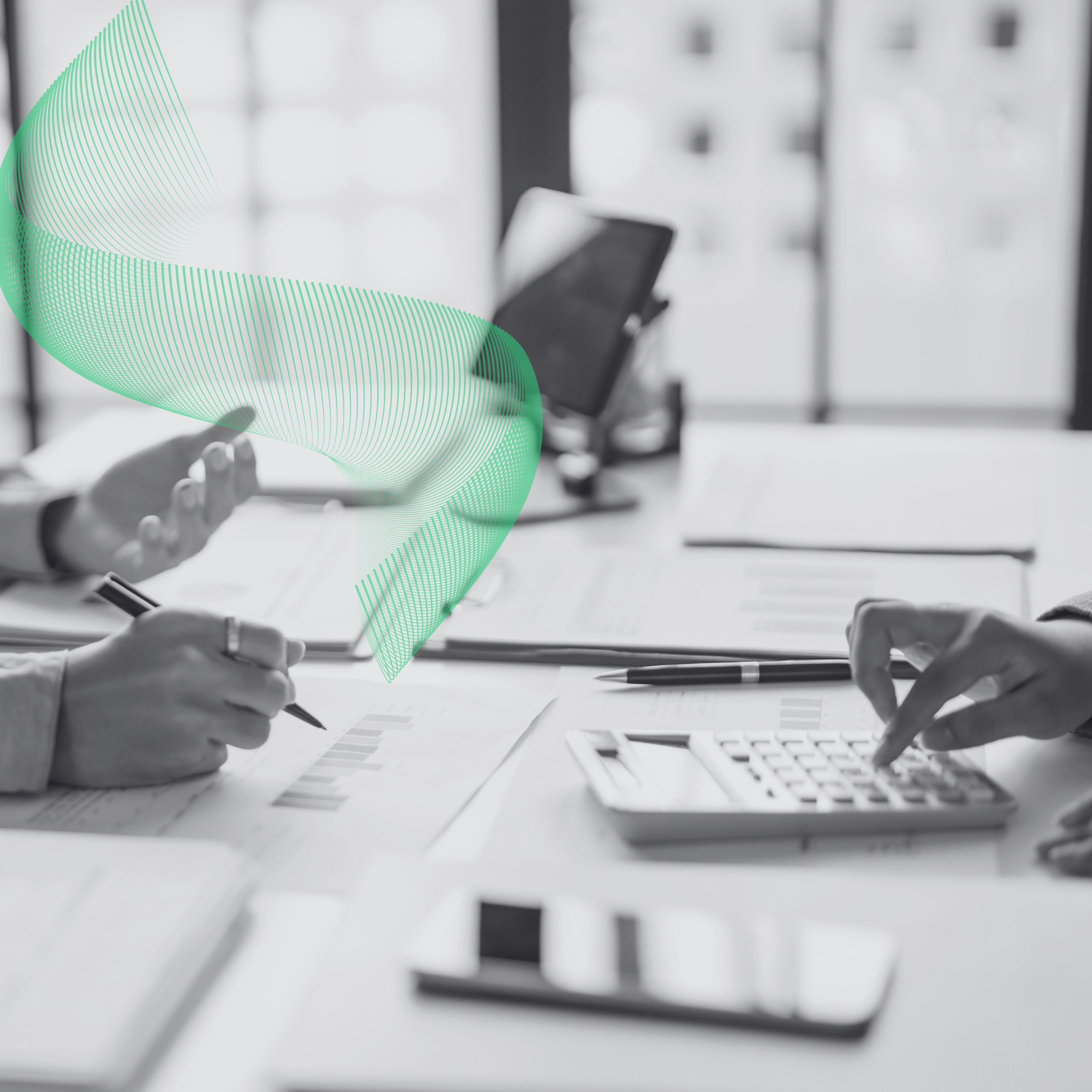 Finance team reviewing documents and working on a calculator at a desk, with a green JOT ribbon graphic
